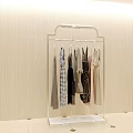 Transparent Clothes Rack Metal Frame With Multiple Hanging Clothes On Beige Wall Light Tiled Floor 3d model
