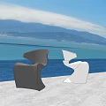 Modern Black And White Lounge Chairs With Unique Design On Outdoor Terrace Under Blue Sky