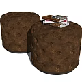 Brown Round Tufted Leather Ottoman Stools With Stack Of Books And Decorative Design