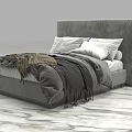 Modern Upholstered Double Bed With Light Grey Pillows And Dark Blanket On Marble Floor