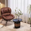 Brown Leather Armchair With Small Round Table Potted Plant Floor Lamp And Rug