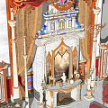 Ornate Classic Fireplace With Marble Columns Draperies Statues And Armchair In Elegant Room