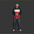 Man Standing in Navy Blue White and Red Hoodie With Gray Pants and White Shoes
