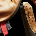 Pair of Brown and Black Leather Fabric Gloves With Detailed Stitching And Wrist Cuffs