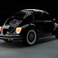 Classic Black Volkswagen Beetle Driving At Night With Motion Blur