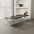 Two Modern Black Stools With Silver Metal Frame In Sleek Contemporary Room
