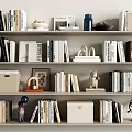 Bookshelf with Various Books and Decorative Items Like Globe Sculpture and Photo Frame
