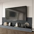 Modern Gray TV Stand with Mounted TV and Decorative Items on Wooden Floor