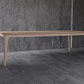Light Colored Wooden Dining Table In Minimalist Modern Room With Gray Wall And Floor