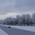 Road Facilities Along Snow Covered Street With Street Lamps And Parked Car Under Overcast Sky