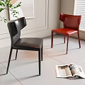Black and Red Leather Upholstered Modern Dining Chairs with Open Magazine Near Plant and Window