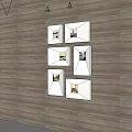 Six Framed Wall Art Paintings Arranged in Gallery Style on Wooden Floor Background