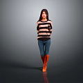 Woman In Striped Sweater Blue Jeans And Orange Boots Against Gray Background