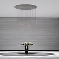 Modern Spiral Chandelier Hanging In Gray Textured Wall Interior With Flower Decorated Table