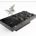Modern Black Marble Coffee Table With Mountain Like Texture And Green Plant 3d model