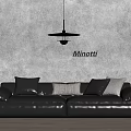 Black Leather Sectional Sofa With Multiple Cushions Minotti Brand On Grey Wall And Pendant Light