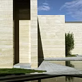 Modern Architectural Courtyard With Pool Statue Grass And Blue Sky
