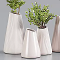 White Conical Striped Vases with Various Green Natural Plants and Fresh Foliage