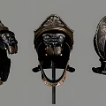 Two Ancient Helmets With Black Base Gold Accents And Intricate Carved Patterns