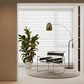 Modern Single Chair With Metal Frame Arched Floor Lamp Large Green Plant And Window Blinds