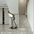 Marble Stairs In Modern Interior With Human Shaped Sculpture Lamp