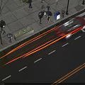 People walking on sidewalk near red car at crosswalk with wet road surface and street lamps