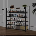 Modern Black Multi Tier Shoe Rack With Various Shoes Storage Boxes Plant Bag And Books