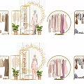 Golden Clothes Hangers Displaying Various Dresses Coats In Fashion Retail Setup With Plants Mirrors