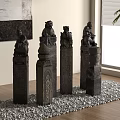 Decorative Stone Pillars With Carved Lion Statues On Pebble Surface In Interior
