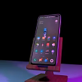 Smartphone on Wooden Stand with Screen Displaying App Icons Dark Background Purple Blue Lighting