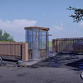 Modern Glass Security Booth With Cyclist Passing By Wooden Fence And Green Trees
