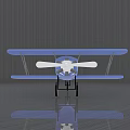 Blue Biplane Passenger Plane with White Propeller Parked on Gray Floor and Reflection