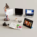 Modern Laptops Display with Lamp Pens Coffee Cup Camera Tablet and Open Notebook 3d model