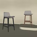 Modern Bar Stools With Light Seats And Black Brown Wooden Legs On Display Platform