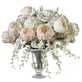 Glass Vase With White And Blush Roses Hydrangeas Small White Flowers And Green Foliage