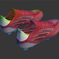 Red Athletic Soccer Shoes With White And Yellow Accents And Spiked Soles