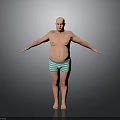 Bald Shirtless Man Standing With Arms Outstretched In Green Striped Shorts Against Gray Background