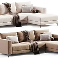 Modern L Shaped Upholstered Sofa in Neutral Tones With Throw Blanket Decorative Pillows and Balls