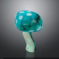 Teal Colored Edible Mushroom With White Spots On Cap And Brown Stem