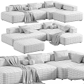 Modern Sectional Sofa Set With Grey White Upholstery Pillows Blankets And Ottoman