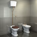Toilet With Brown Seat Bidet Gray Tiled Walls Dark Flooring And Gold Fixtures