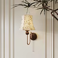 Beige Floral Wall Lamp With Wooden Base On White Vertical Striped Wall Near Green Plant
