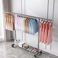 Rolling Clothes Rack with Colorful Dresses Shirts Storage Boxes Woven Basket and Shoes