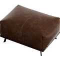 Brown Leather Ottoman With Textured Surface And Black Legs For Home Decor