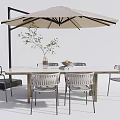Outdoor Dining Table With Wicker Chairs And Parasol Green Plant And Fruit Vase Decoration