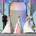 Three Women In White Pink Wedding Dresses Standing Before Colorful Decorated Arch With Clothing