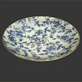 Blue and White Porcelain Plate With Floral Patterns and Leaf Designs
