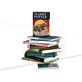 Stack of Assorted Books Including Harry Potter with Colorful Hardcovers on Wooden Table