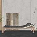 Black Wooden Chaise Lounge with Green Plant and Abstract Wall Art in Modern Gray Room