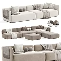 Modern Minimalist Sectional Sofa In Neutral Tones With Decorative Pillows Throw Blankets And Ottomans
